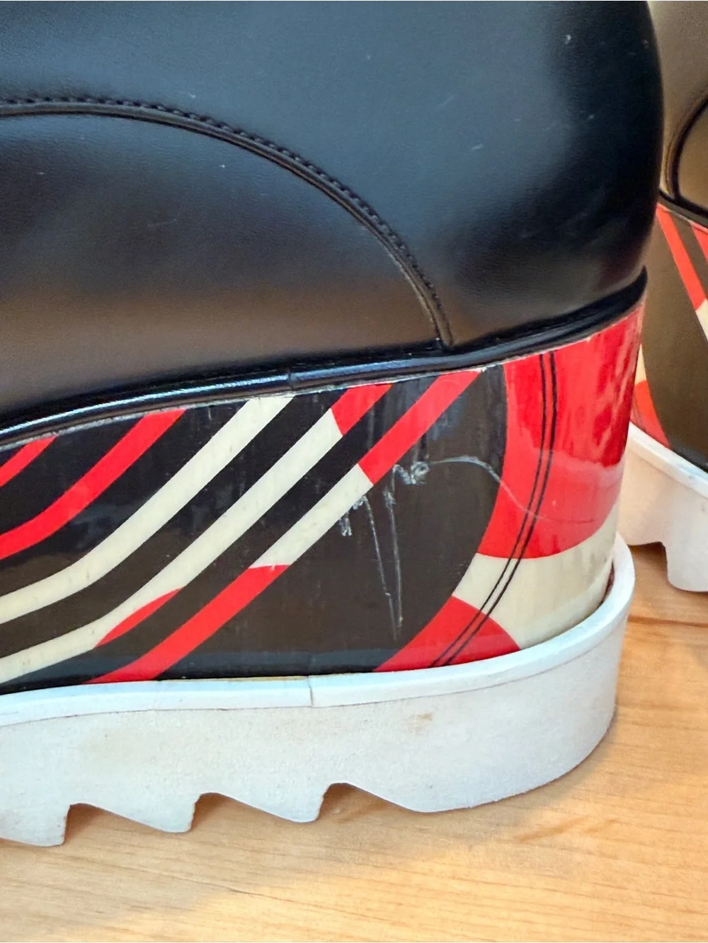 Stella McCartney Black Leather Elyse Platform Shoes with abstract design.